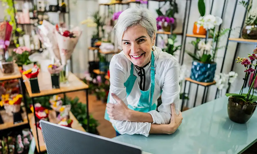 small business owner using technology to manage business