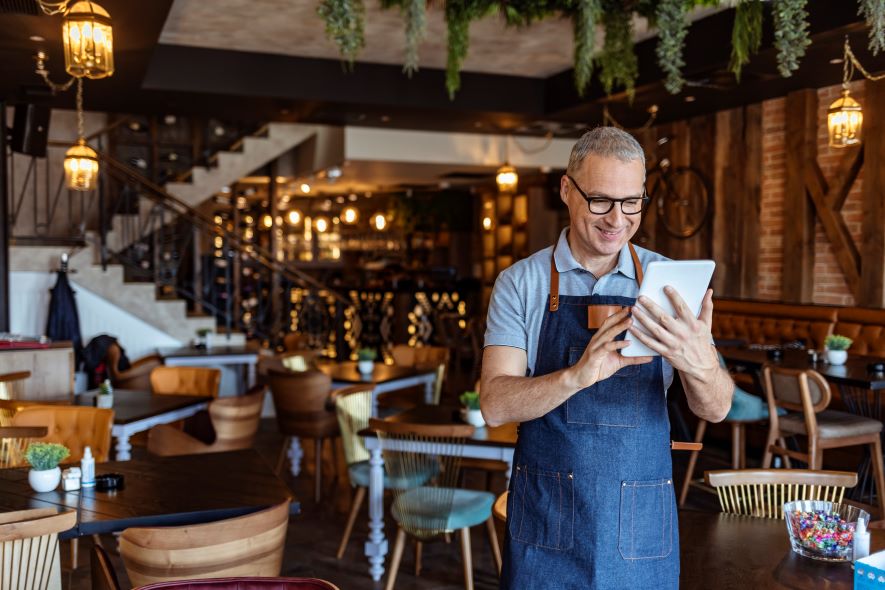 restaurant owner reviewing costs