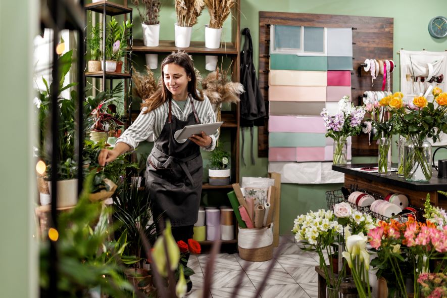 small business owner taking inventory at shop